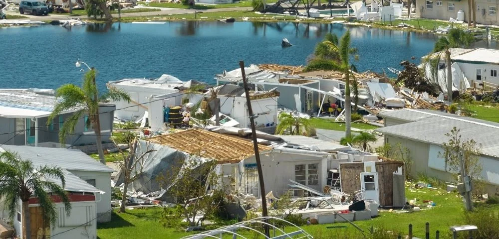 destroyed houses next to lake